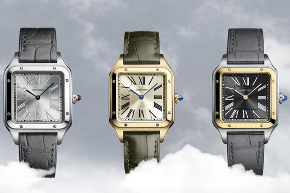 Three stainless steel. gold and stainless steel with gold Cartier Santos-Dumont watches