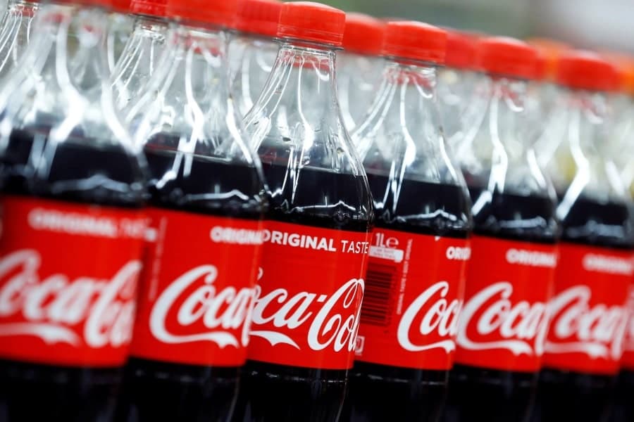 Bottles of Coca Cola in a line
