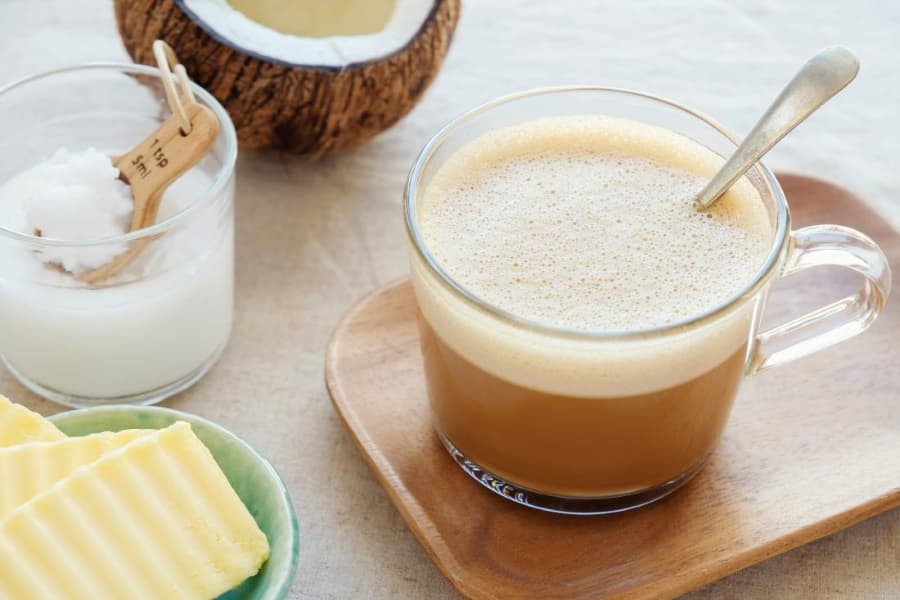 A cup of coffee with a spoon in it