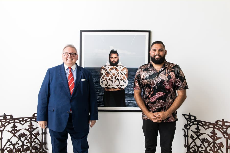 Dennis with the award presenter and his award-winning art titled "Cast In Cast Out"