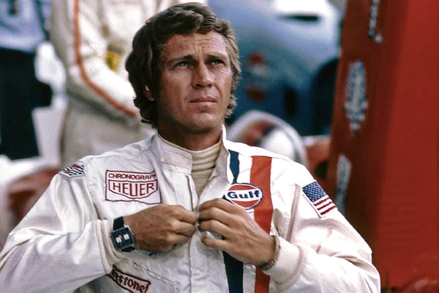 Steve McQueen zipping his jacket