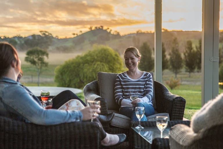 Group of people drinking wine outdoors