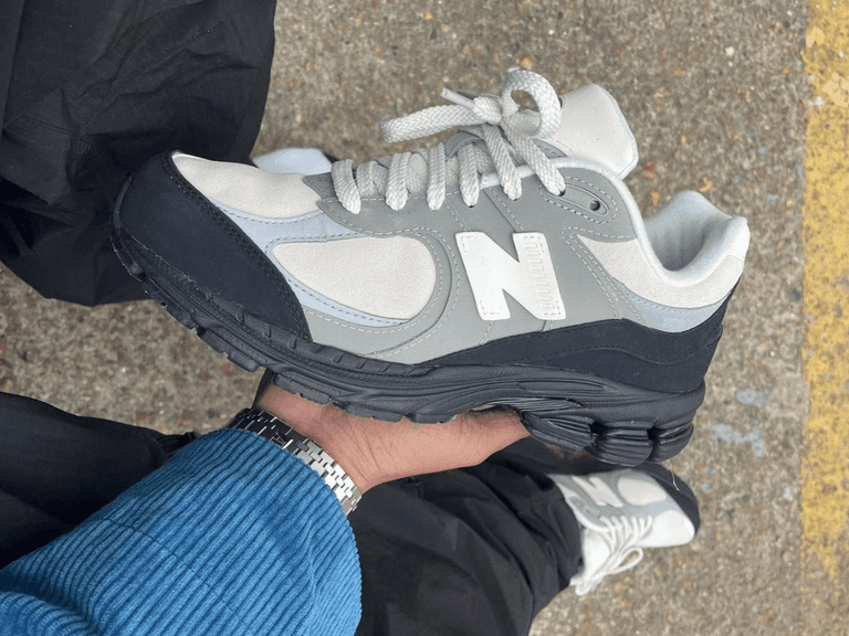 The basement x new balance 2002r in hand