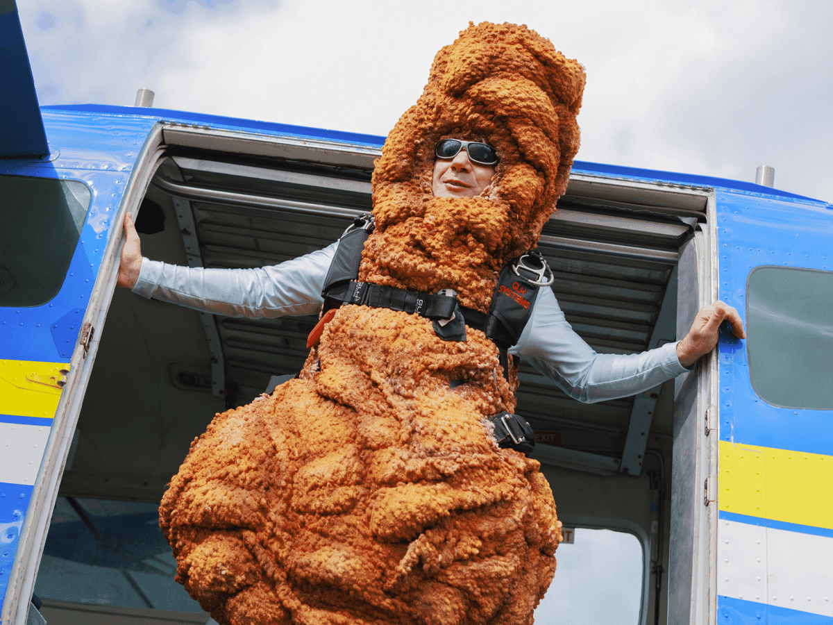 Man wearing a chicken drumstick costume