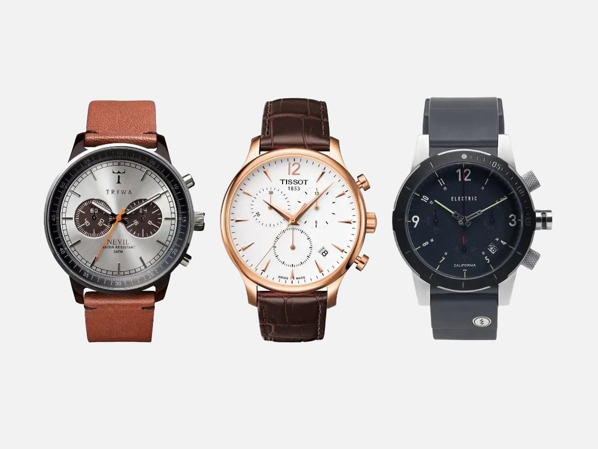 three watches on a grey background