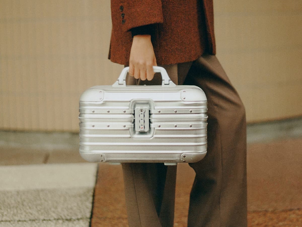 Rimowa vanity case in hand