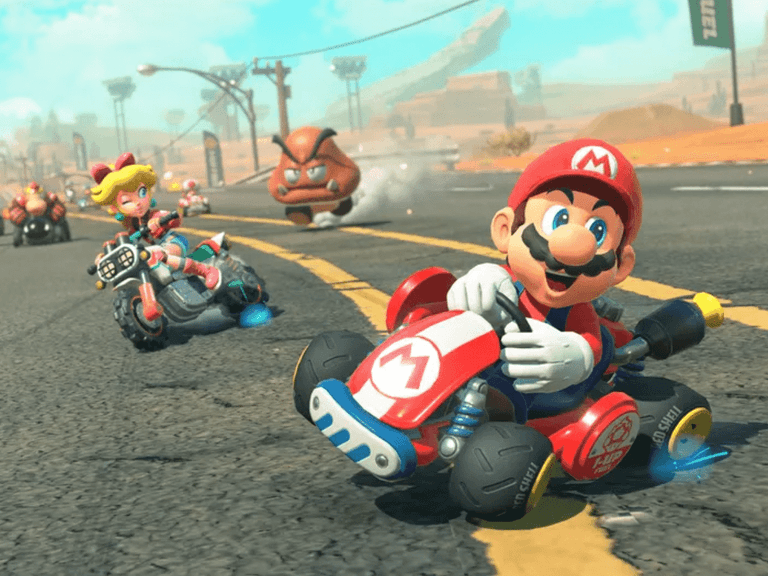Plumber character racing his kart down a desert roadway