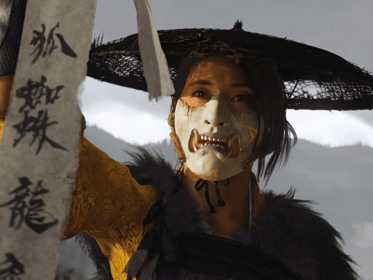 female samurai holding paper with Japanese characters on it