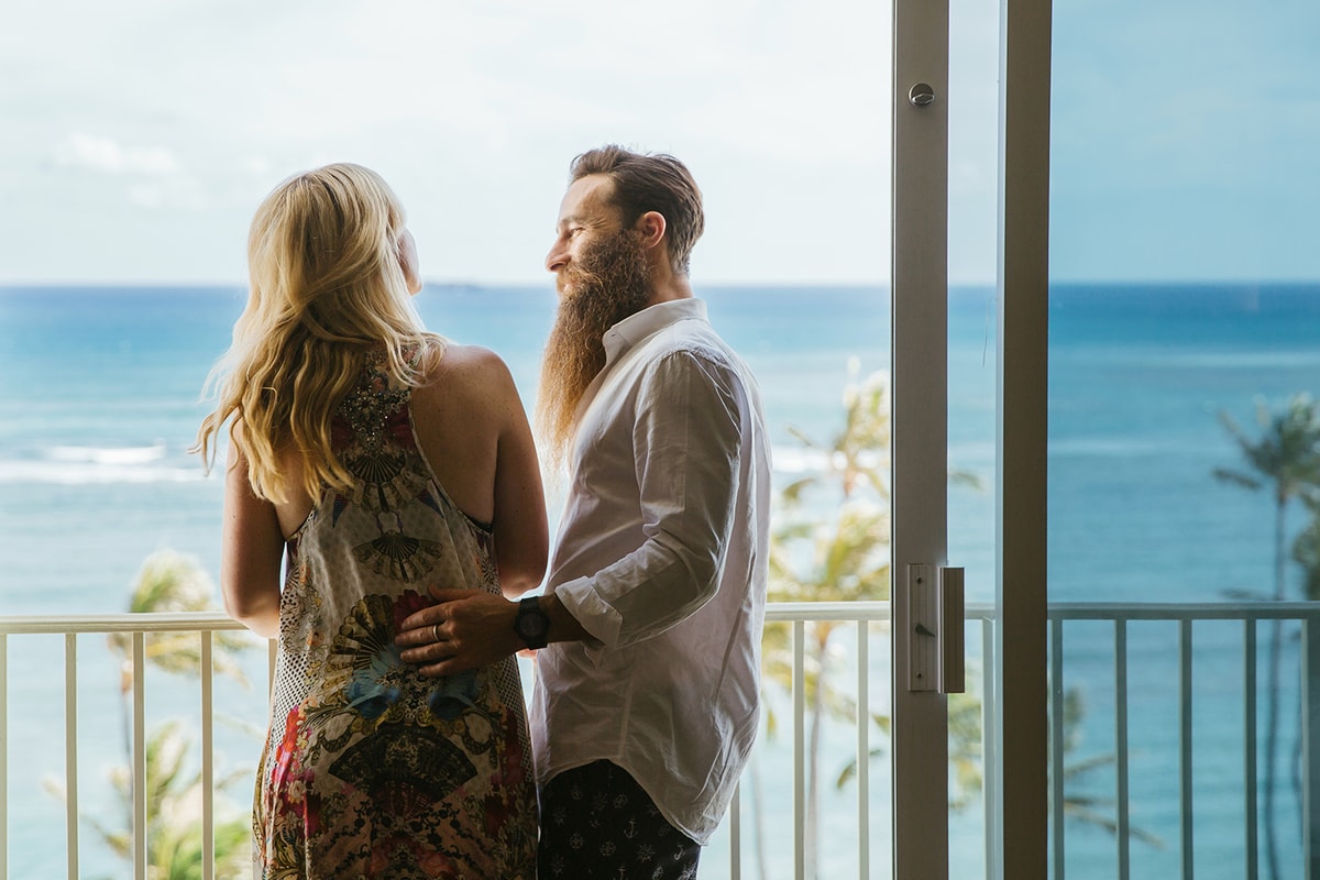 A man and a woman in balcony seen from behind