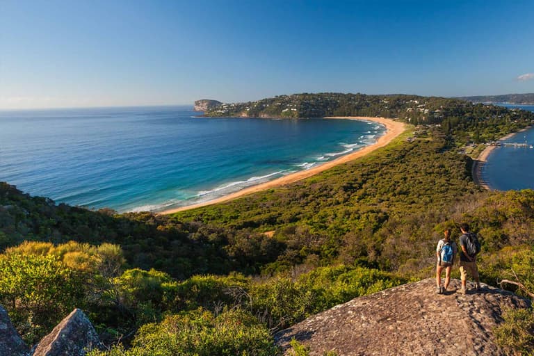 A man and a woman on Barrenjoey Lighthouse Walk
