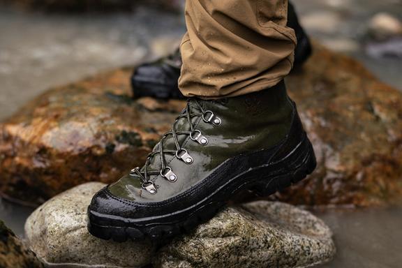 Legs wearing Filson x Danner Combat Hiker boots on rocks