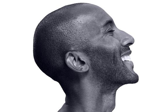 Profile of a bald man smiling