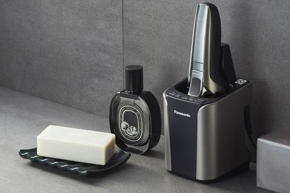 Panasonic ES-LV9Q shaver in its storage charging base on a bathroom platform