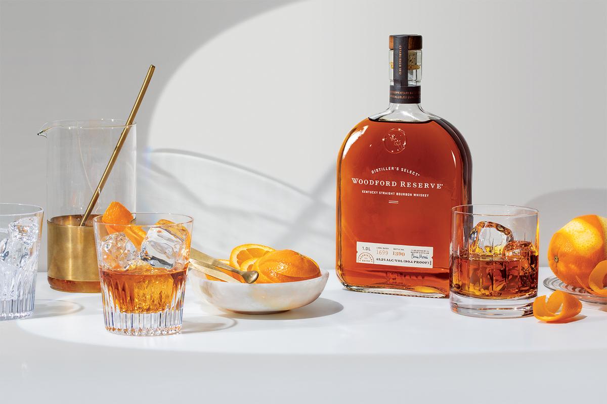 Woodford Reserve Whiskey bottle with oranges and cocktail