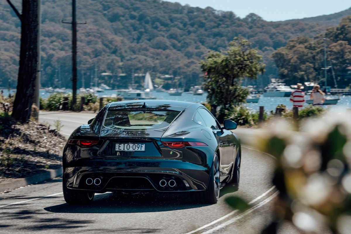 Rear of a black Jaguar F-Type on road