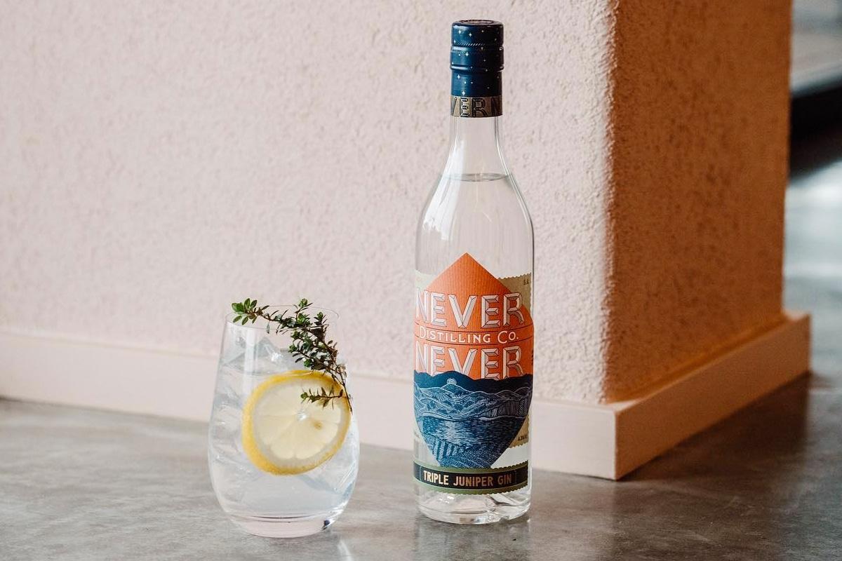Bottle of Never Never next to a glass