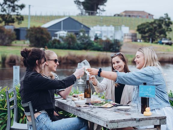 young people drinking wine at puddleduck vineyard