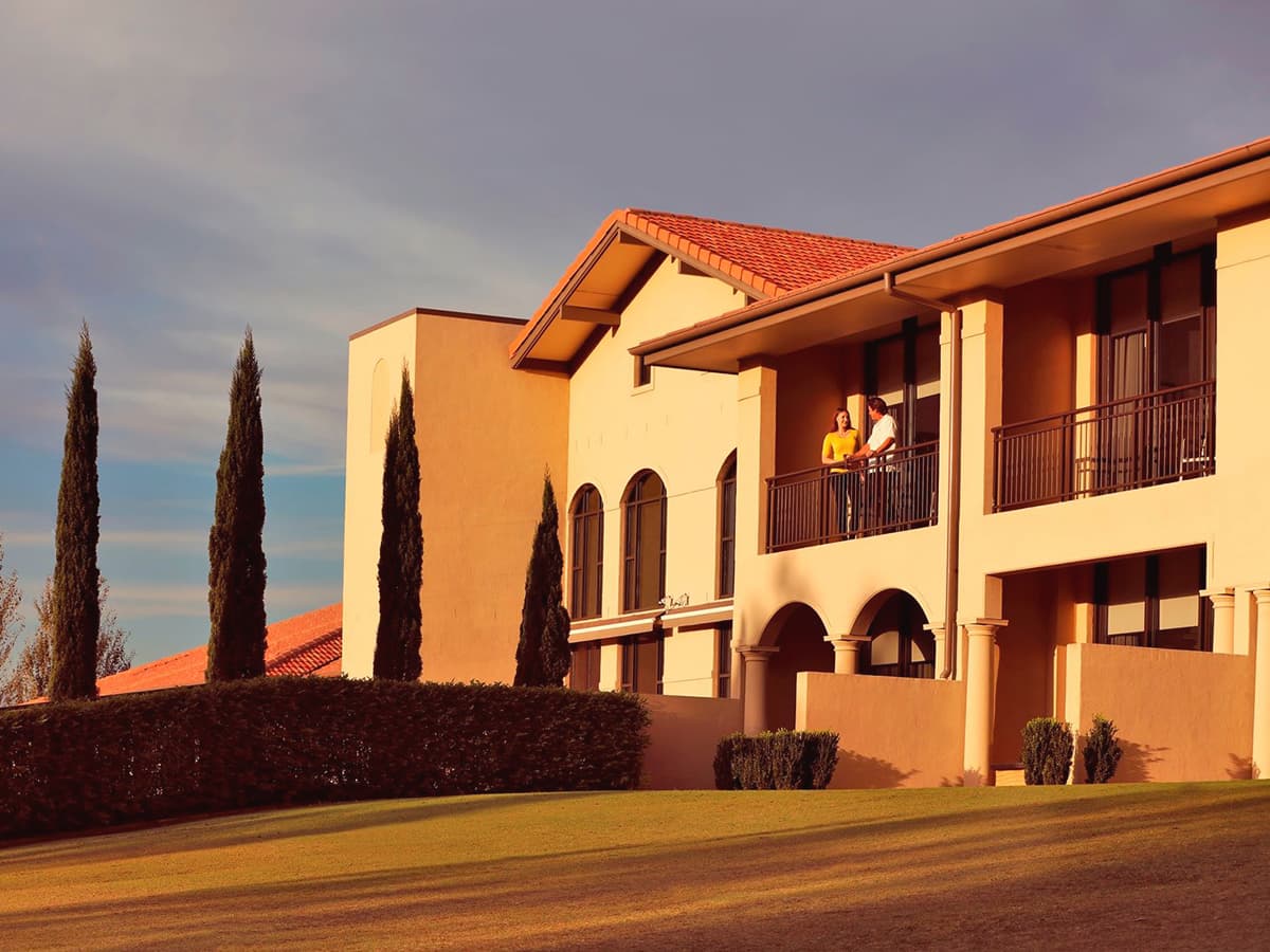 romantic couple on balcony of château elan at the vintage