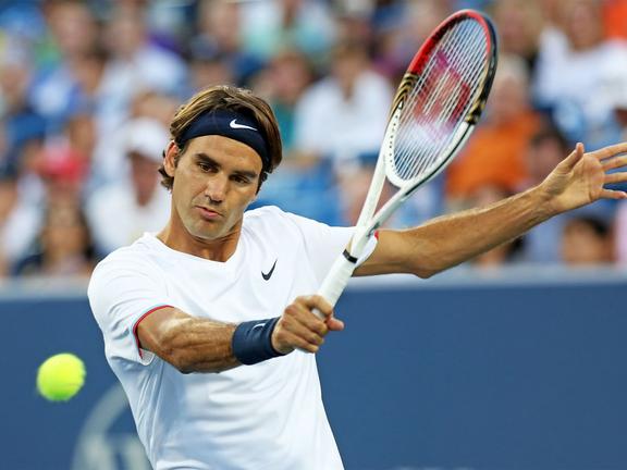 Roger Federer hitting a tennis ball
