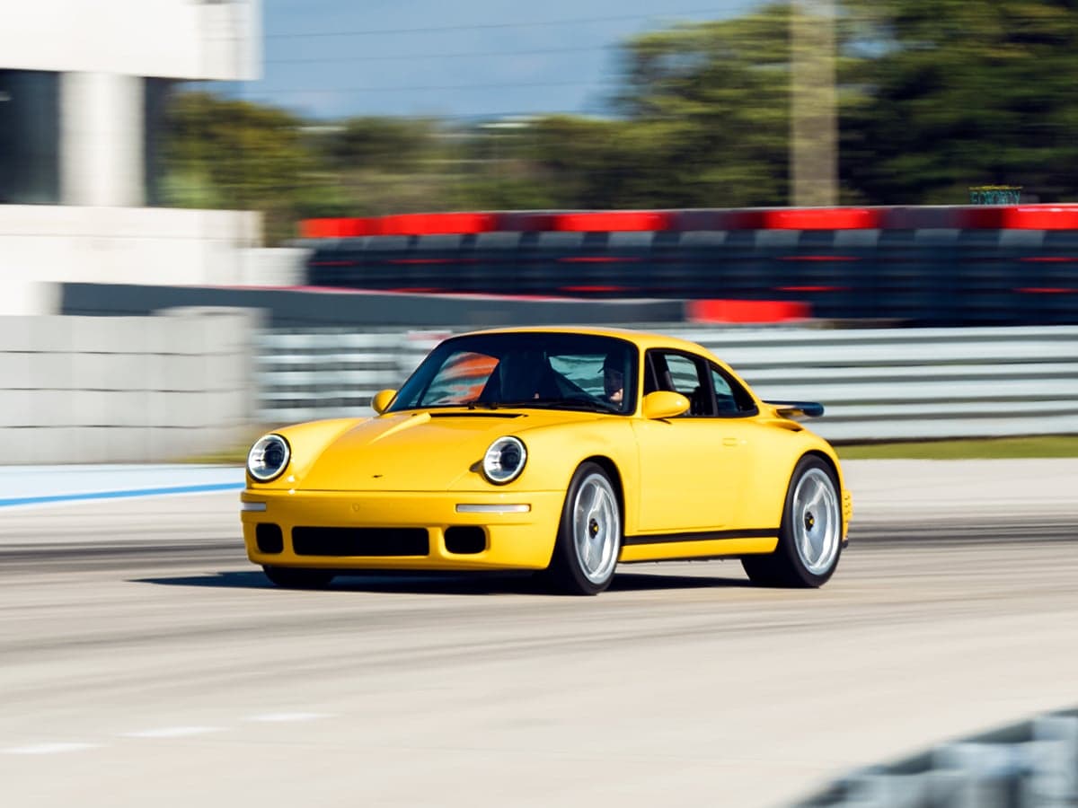 Alois ruf at the concours club in miami yellowbird on racetrack