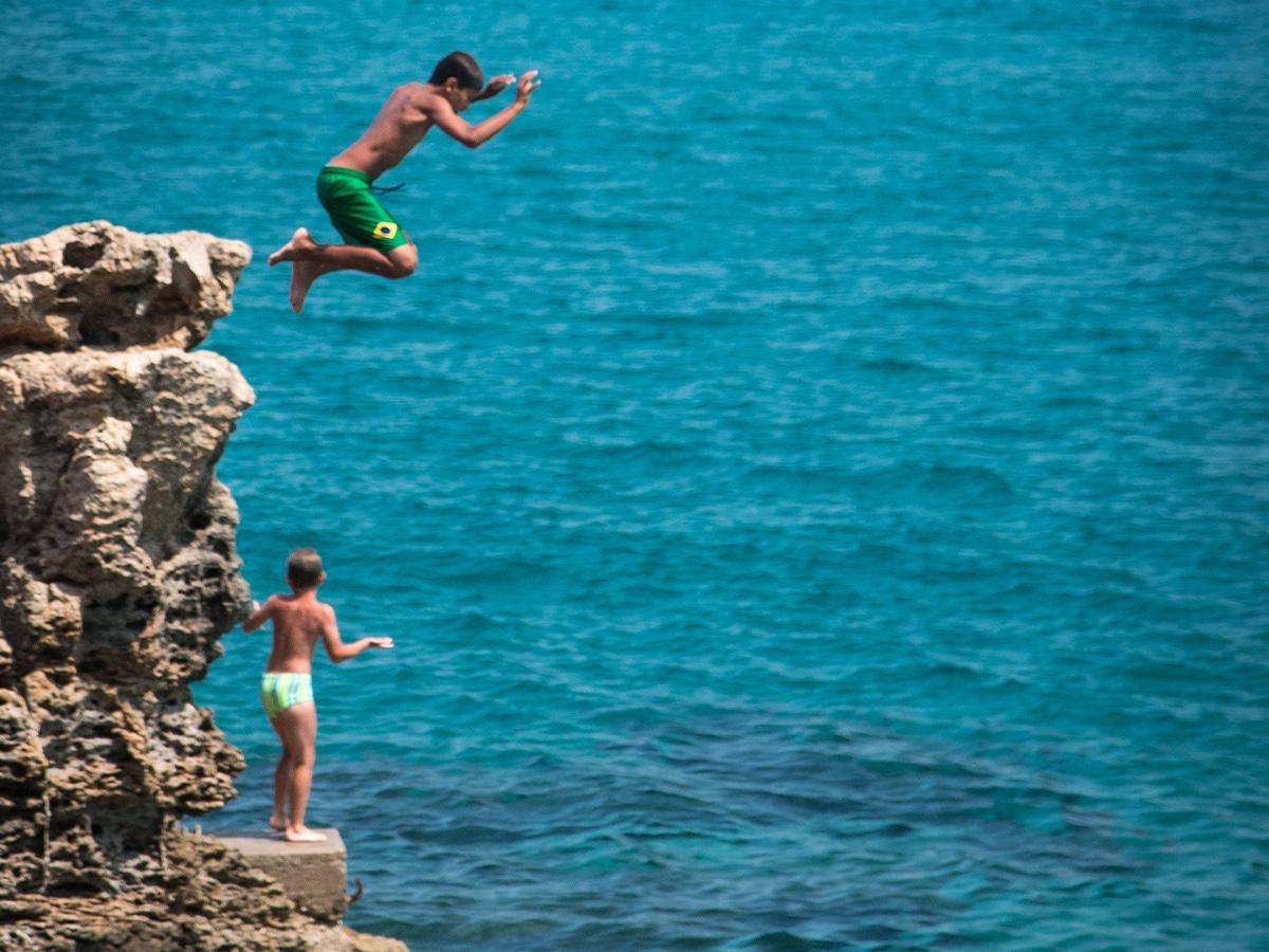 Two friends cliff jumping