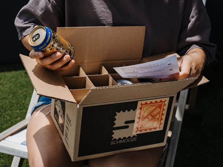 beer subscription box on person's lap