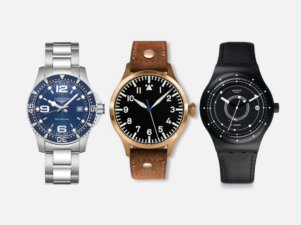 Three different watches with grey background