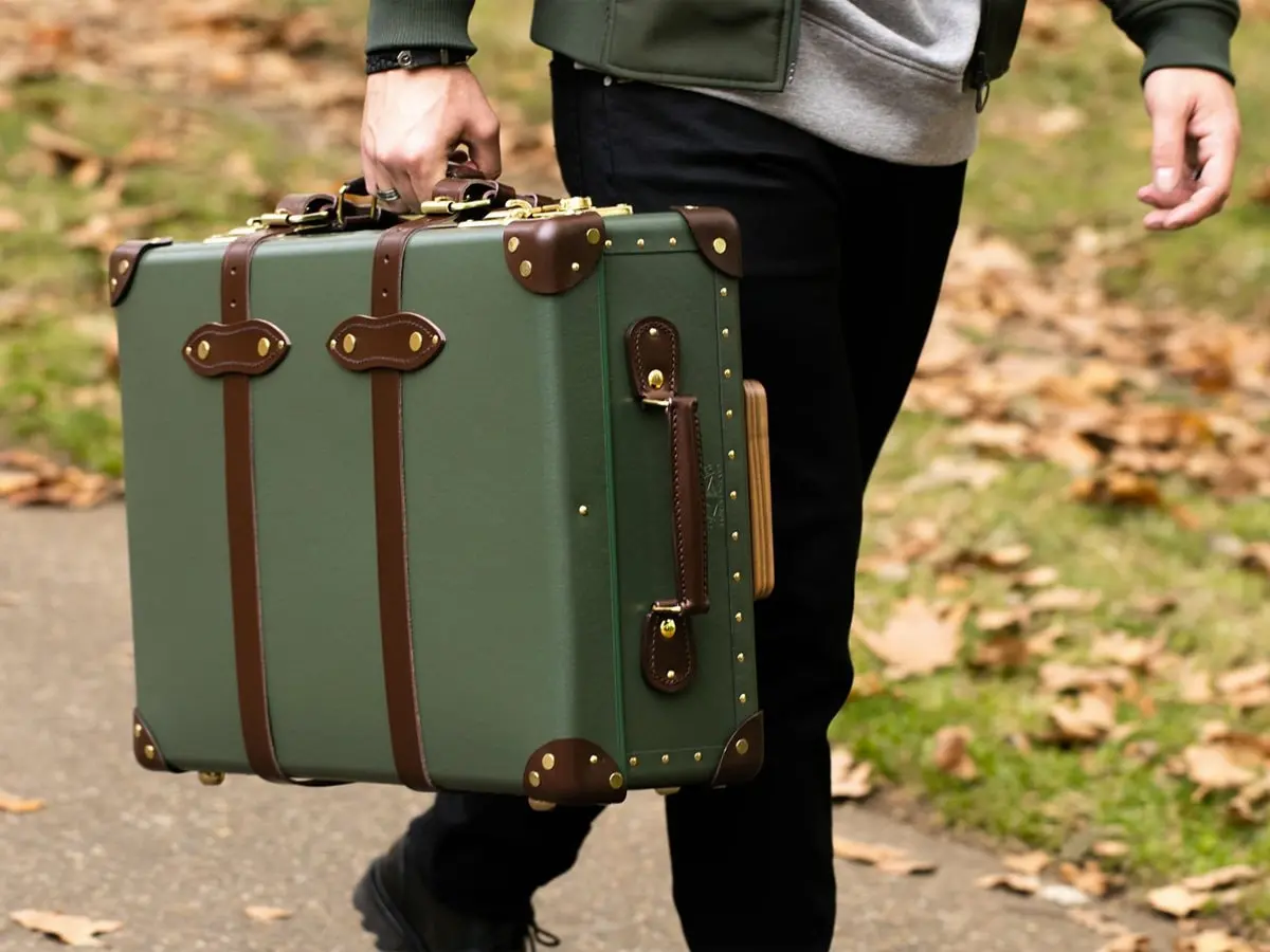 Man carrying Globe-Trotter luggage