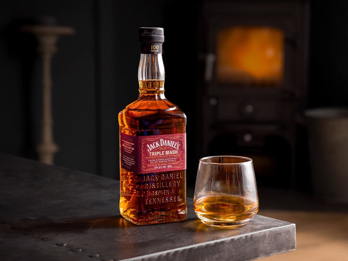 Jack daniels triple mash in bottle and glass