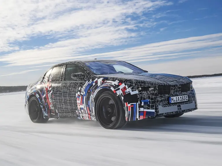 Electric bmw m models on snow front three quarter