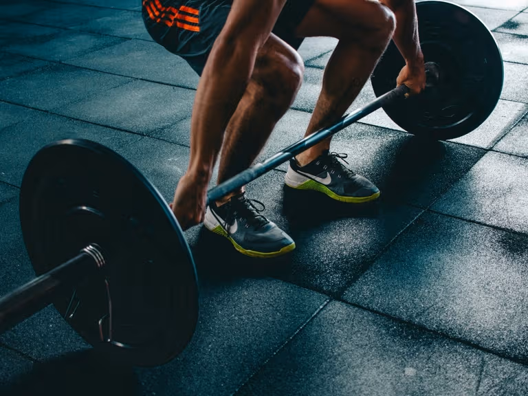 A man lifting weights at the gym
