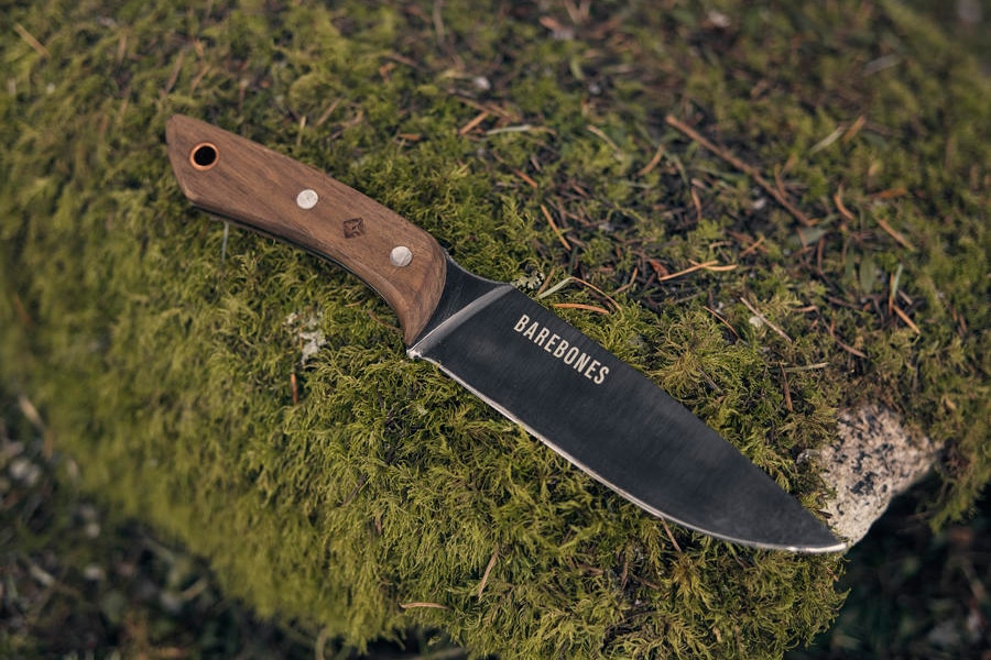 field pocket knife in grassy stone