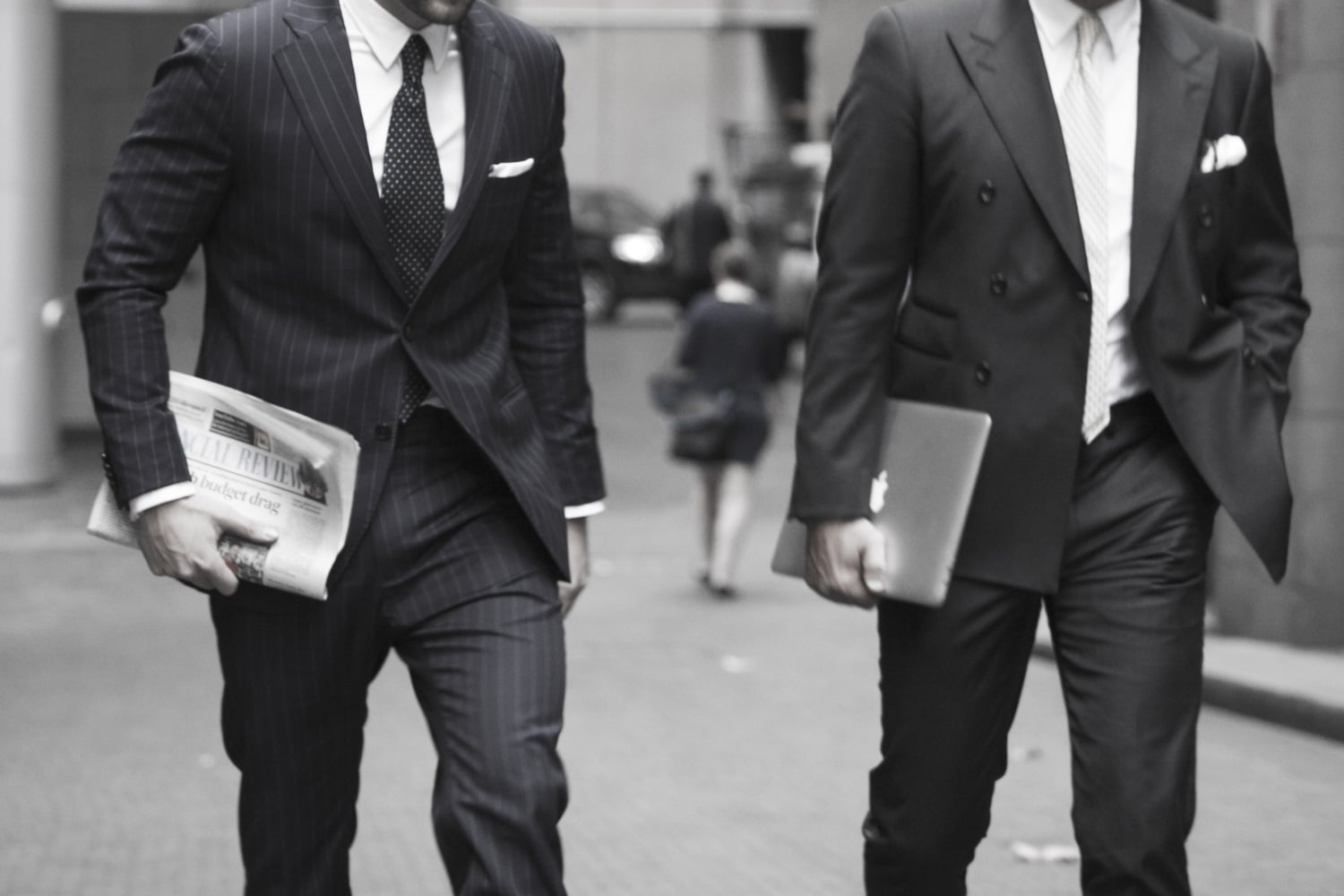 tailored suit persons are walking