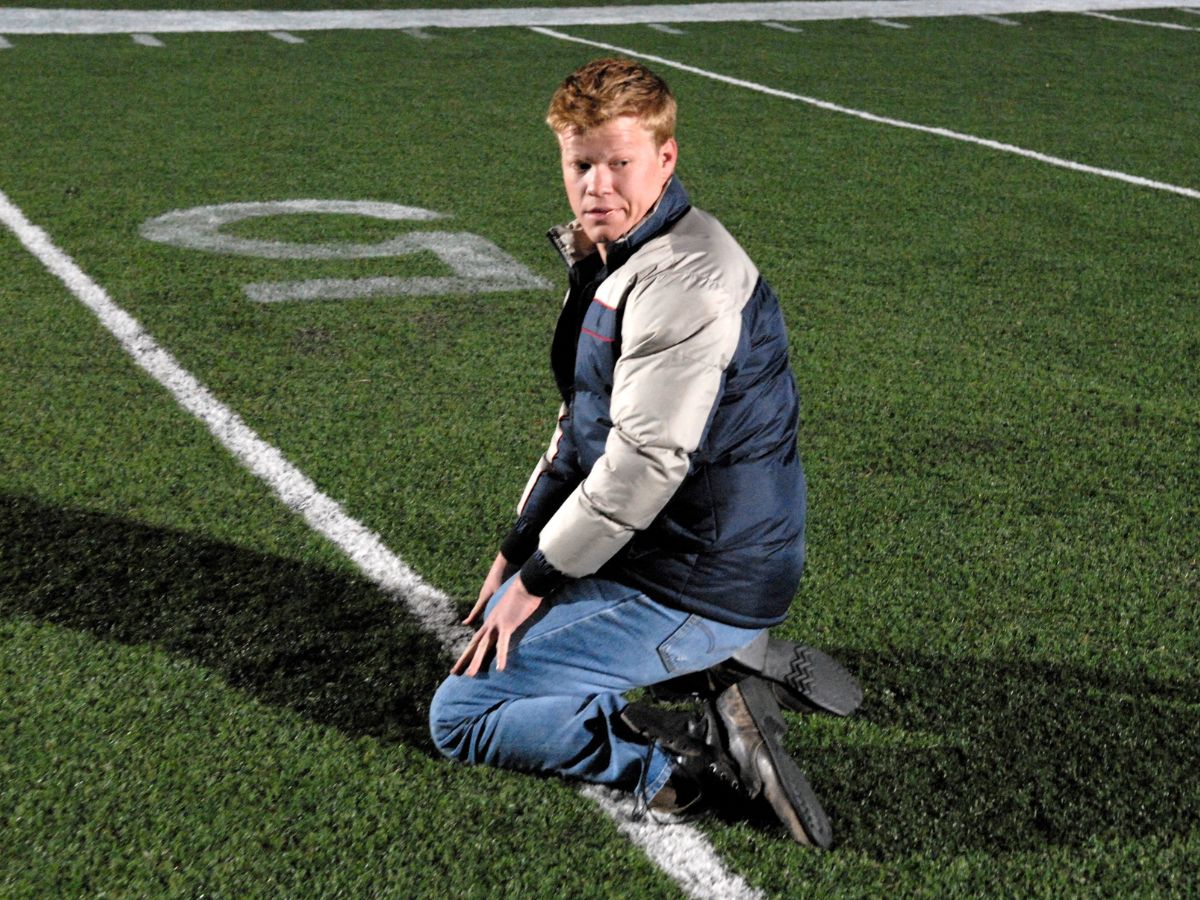 Jesse Plemons on his knees on football ground