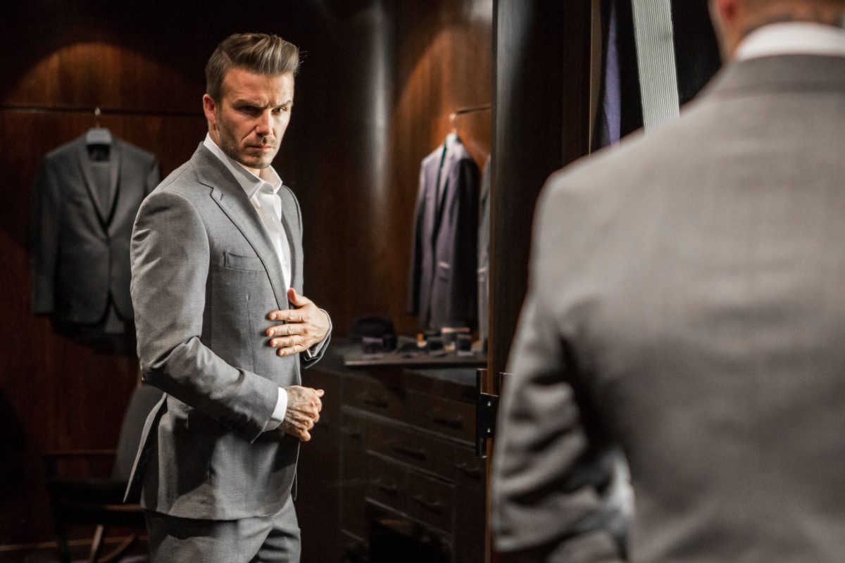 david beckham trying on a suit