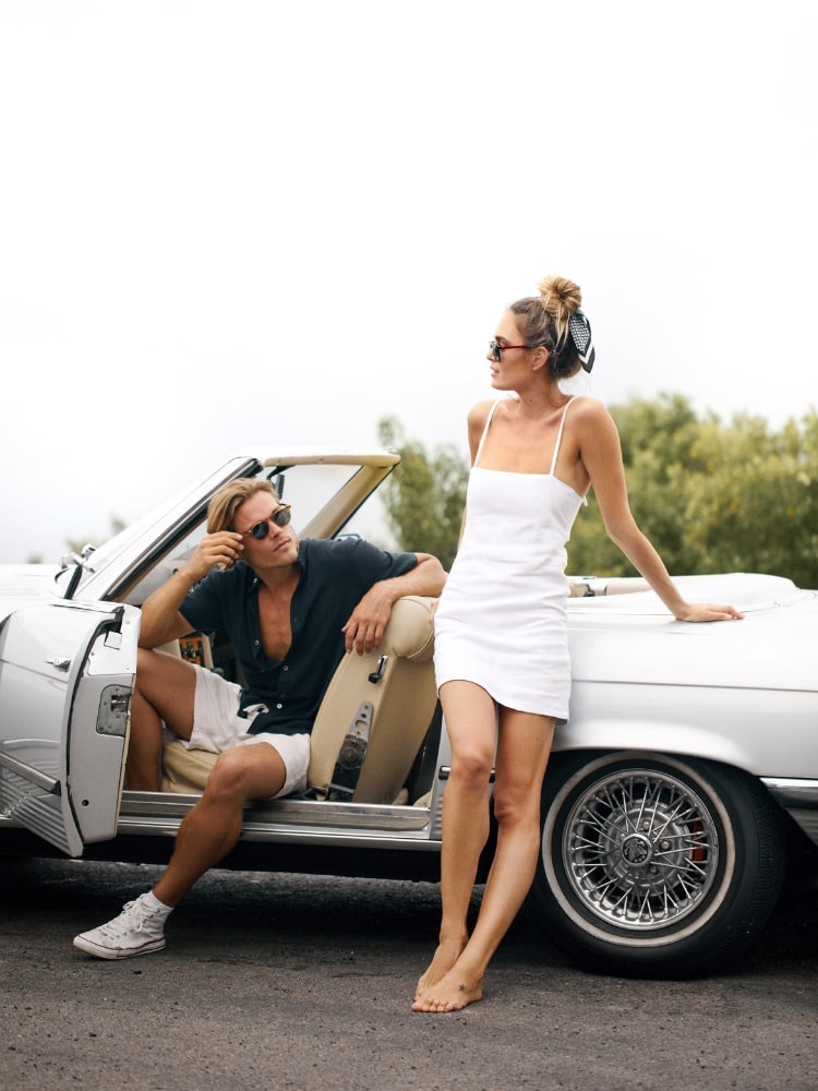 man and woman beside car with pacifico sunglass