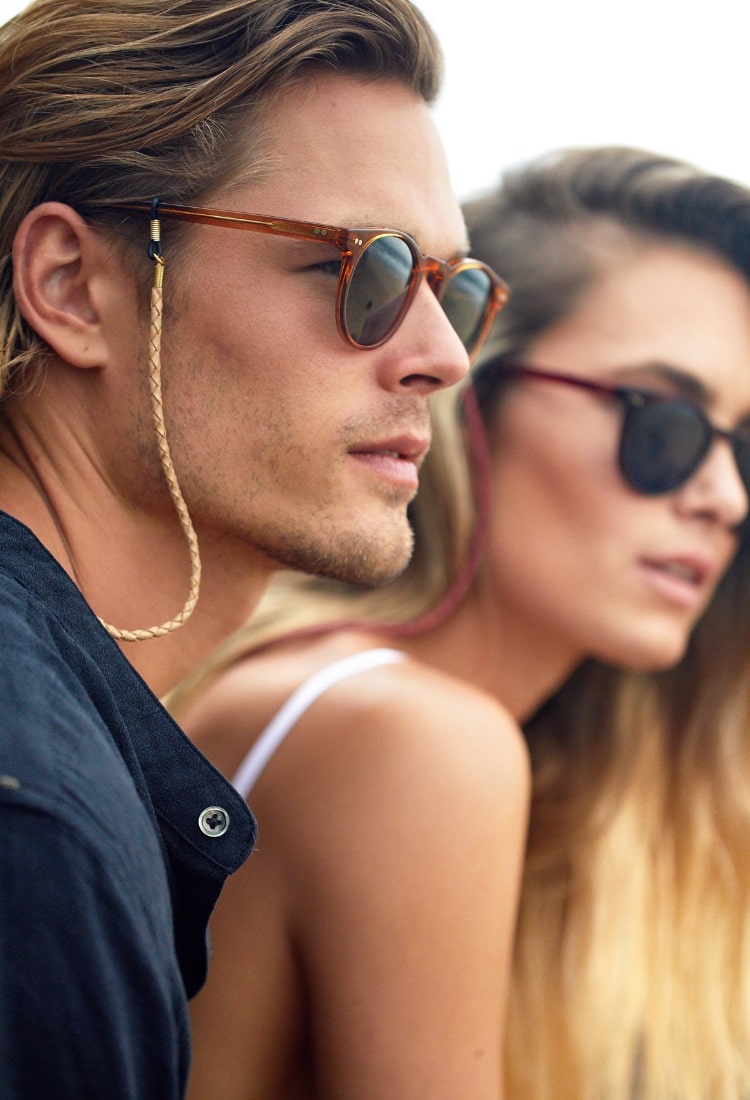 man with woman are looking through pacifico sunglass