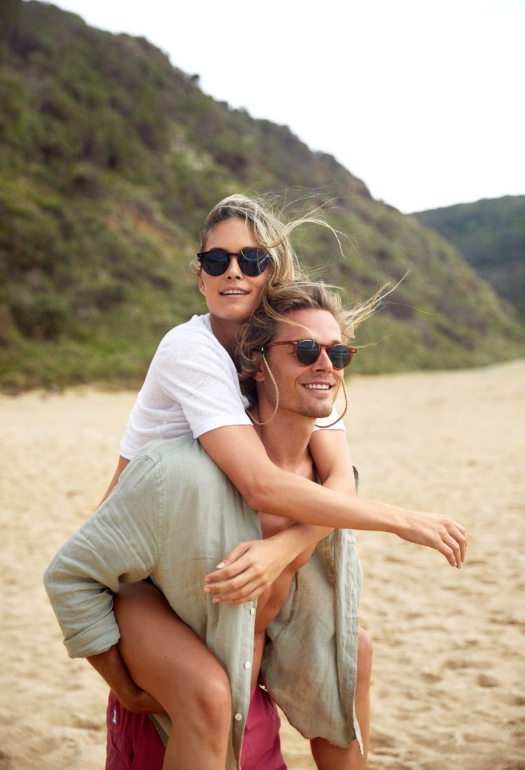 man with woman are looking through sunglass