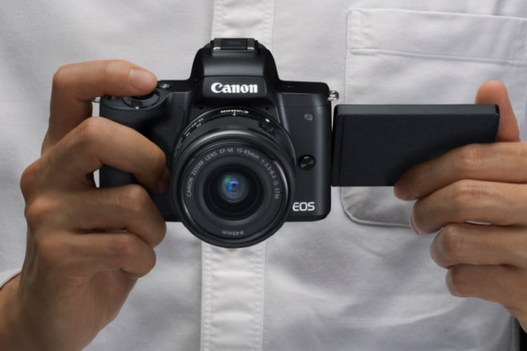canon 4k digital camera on hand