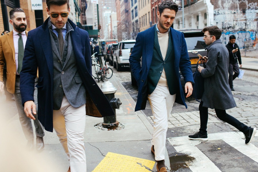 comfortable blue blazer and white slacks walking