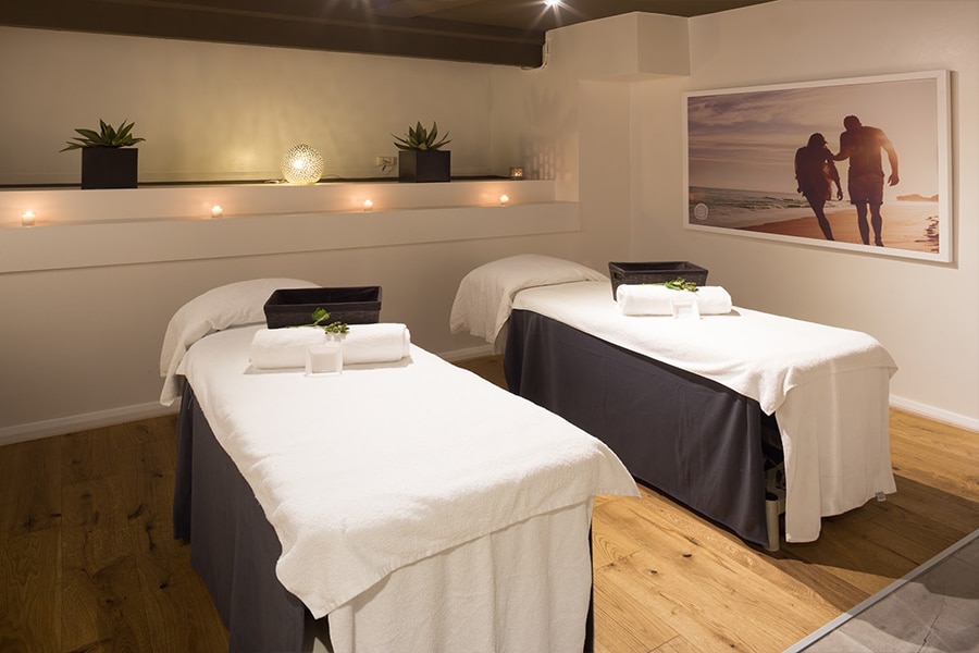 massage room with two single beds