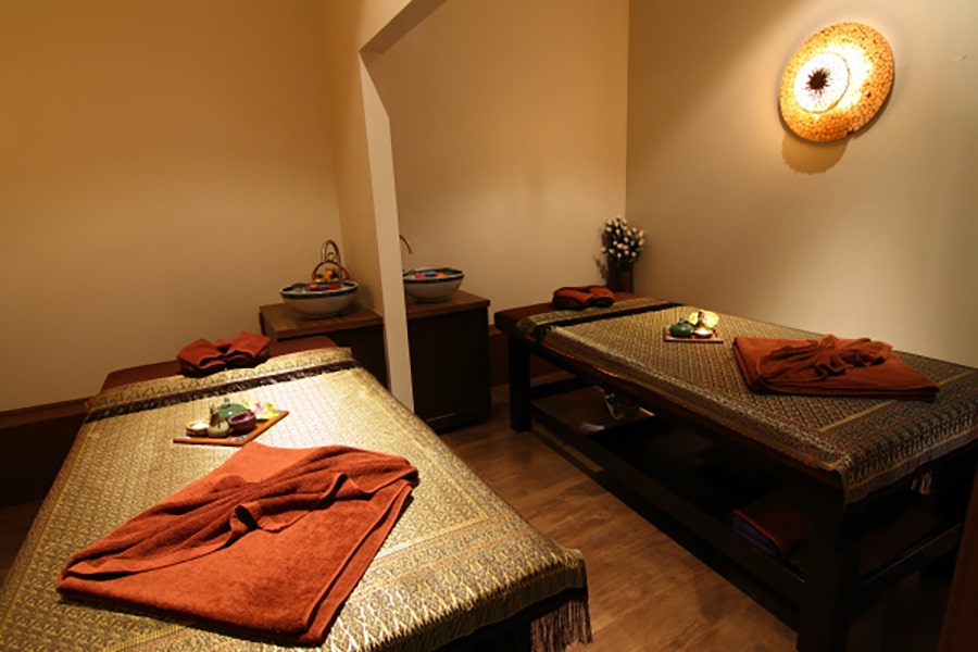 thai style massage room with 2 single beds