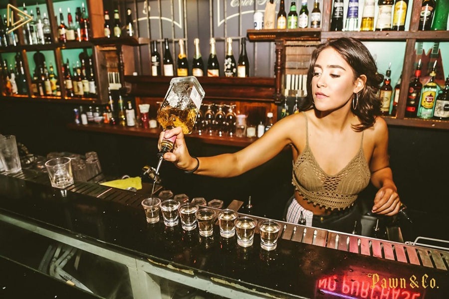 melbourne bar bartender pouring line of shots