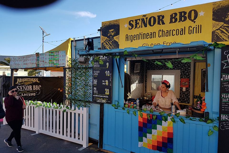 senor bbq shop front woman window