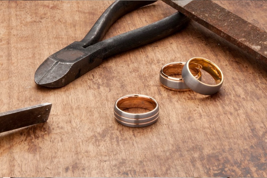men's wedding kavalri rings on workshop bench