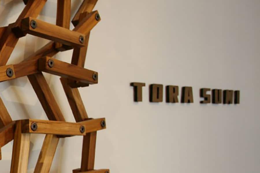 wooden tora sumi sign with abstract wooden artwork 