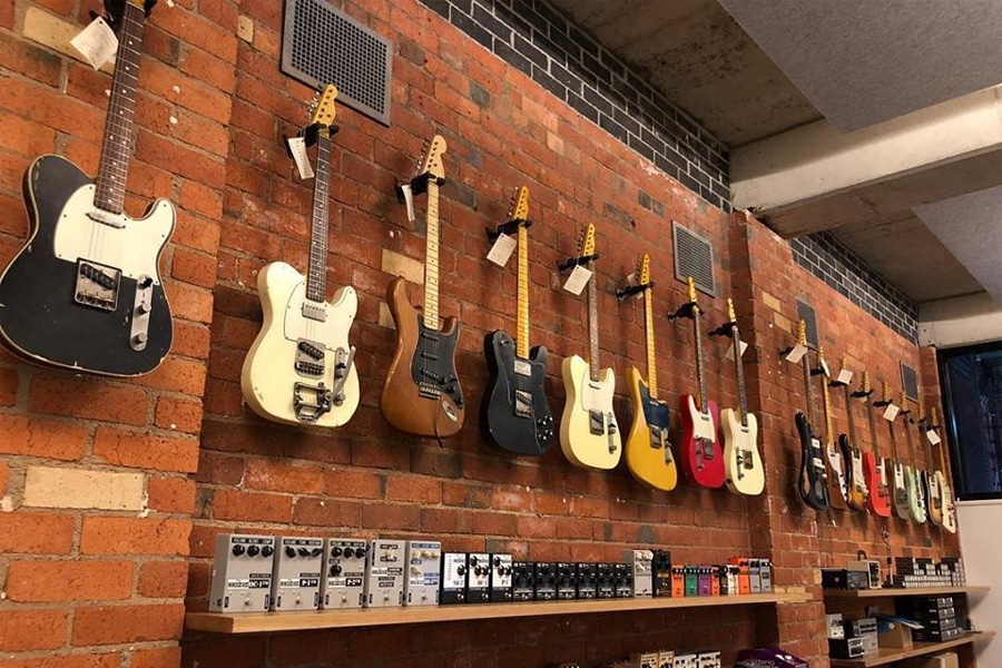 guitars hanging on wall