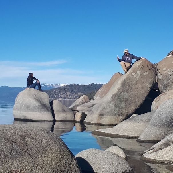 instagram boyfriend taking photo sitting on the stone