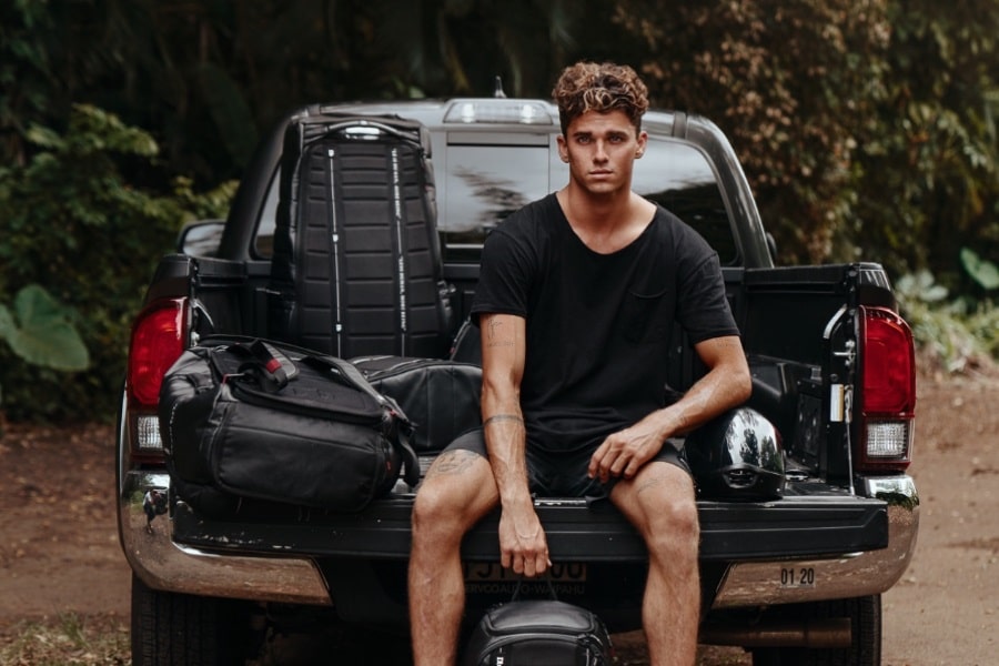 jay alvarrez men sitting on the car