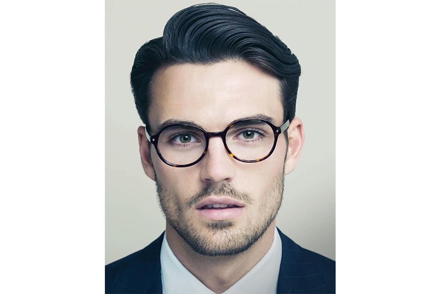 Portrait Of A Handsome Man In Profile With Beard And Short Hair Style He  Has Grey Tshirt And Confident View On Grey Background The Man Looks Away  High-Res Stock Photo - Getty